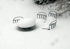 Blizzard burying chairs