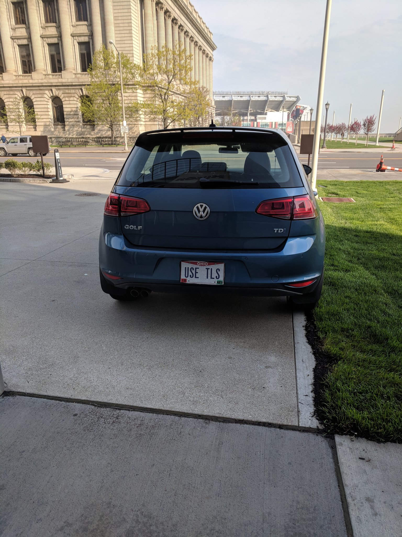 A car with a USE TLS license plate